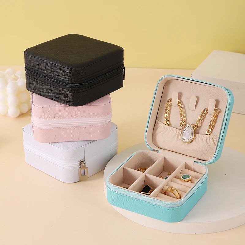 "Open portable jewelry case showing organized accessories"