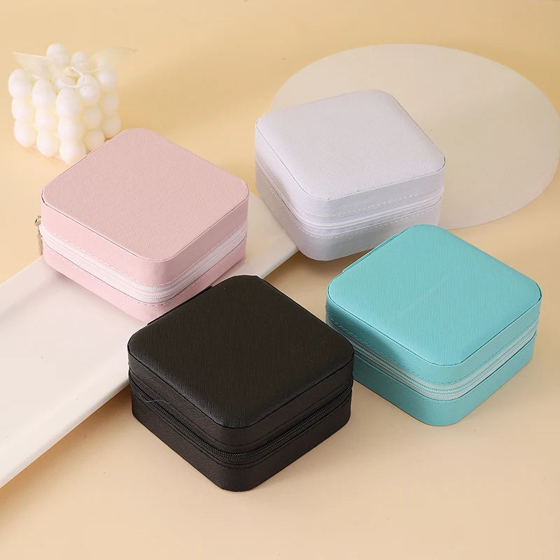 "Open portable jewelry case showing organized accessories"