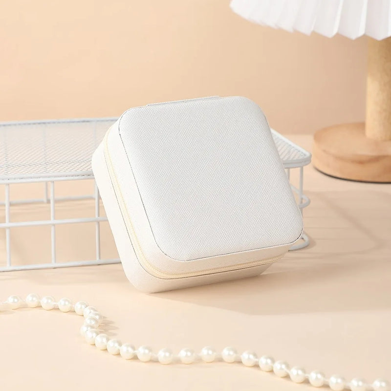 "Open portable jewelry case showing organized accessories"