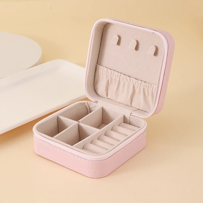 "Open portable jewelry case showing organized accessories"