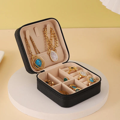 "Open portable jewelry case showing organized accessories"