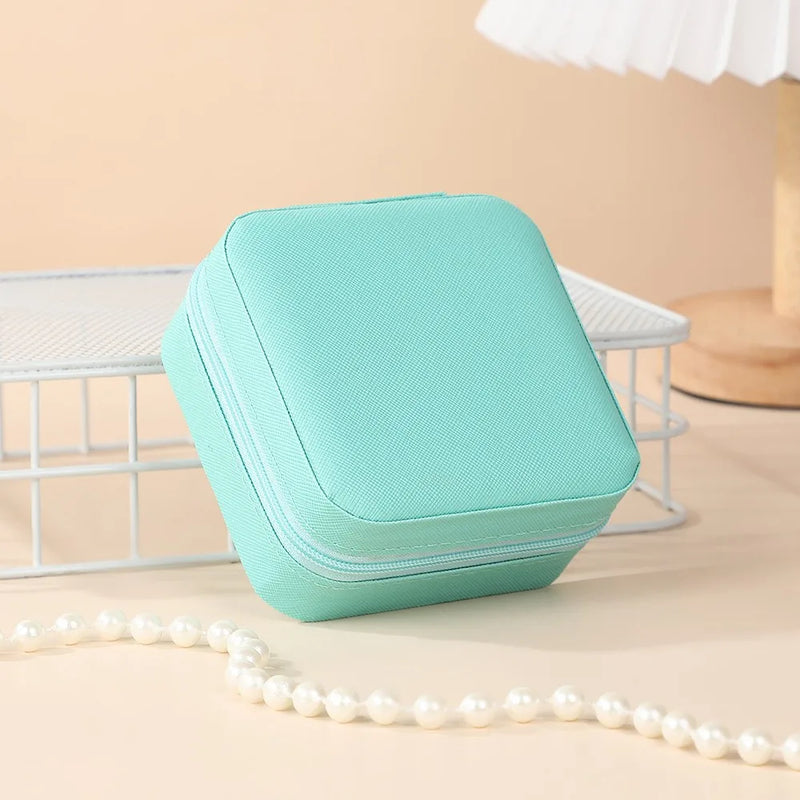 "Open portable jewelry case showing organized accessories"