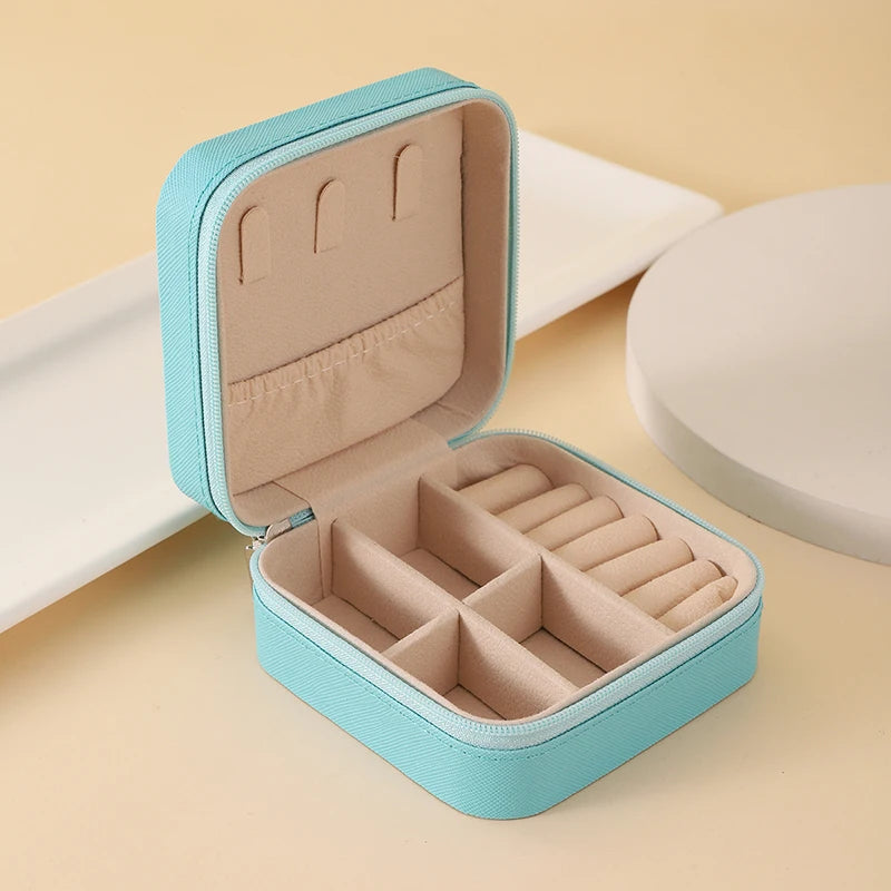 "Open portable jewelry case showing organized accessories"