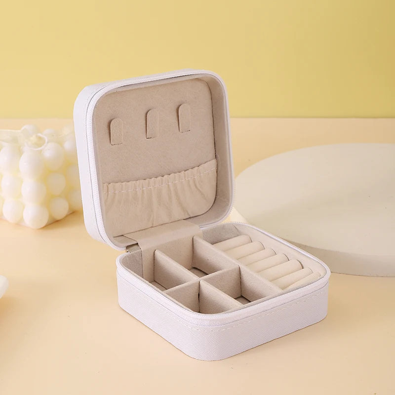 "Open portable jewelry case showing organized accessories"