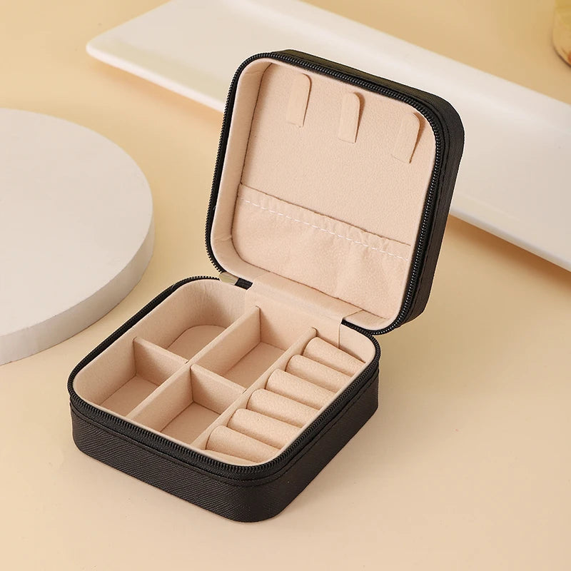 "Open portable jewelry case showing organized accessories"